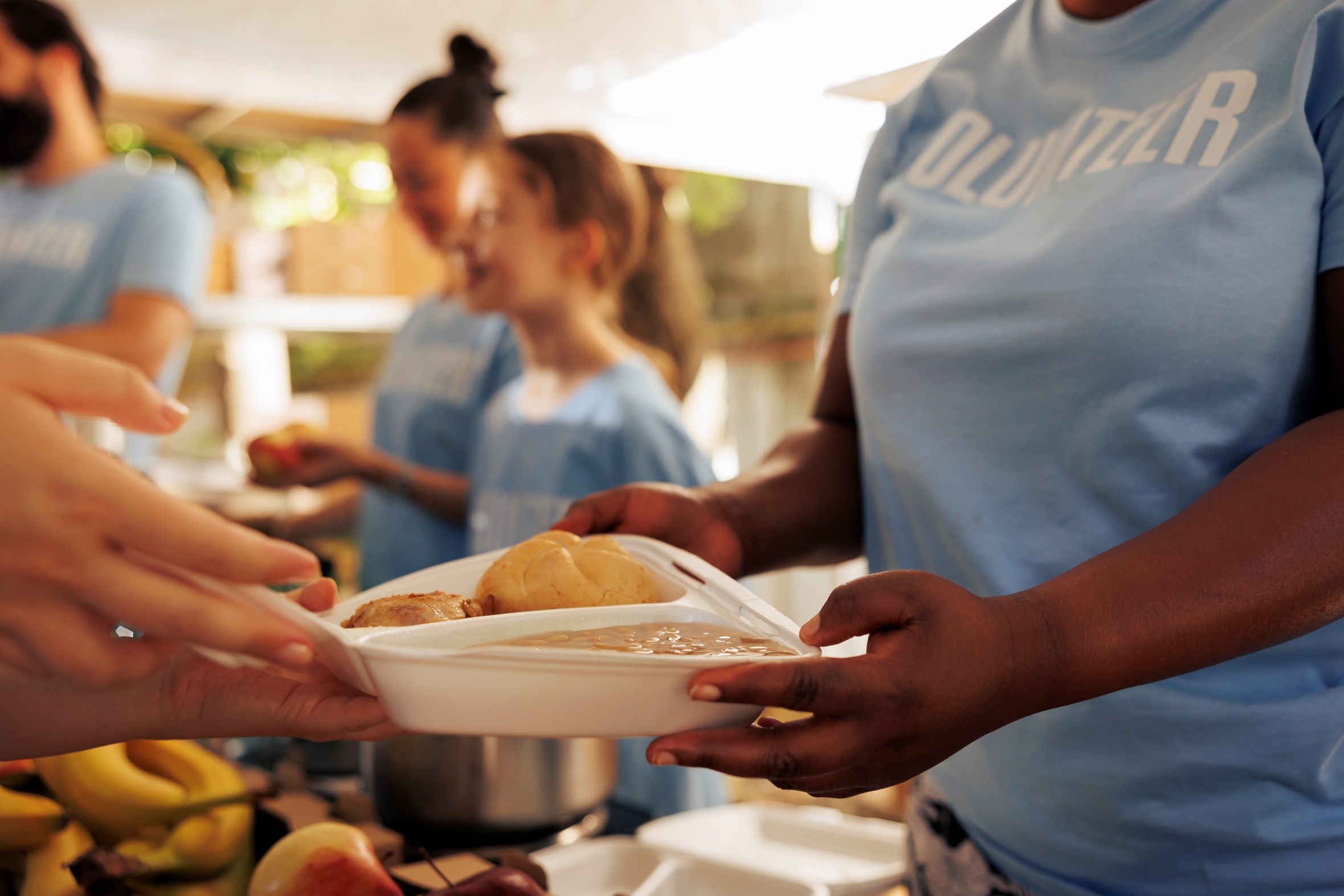 Community volunteers serving meals together